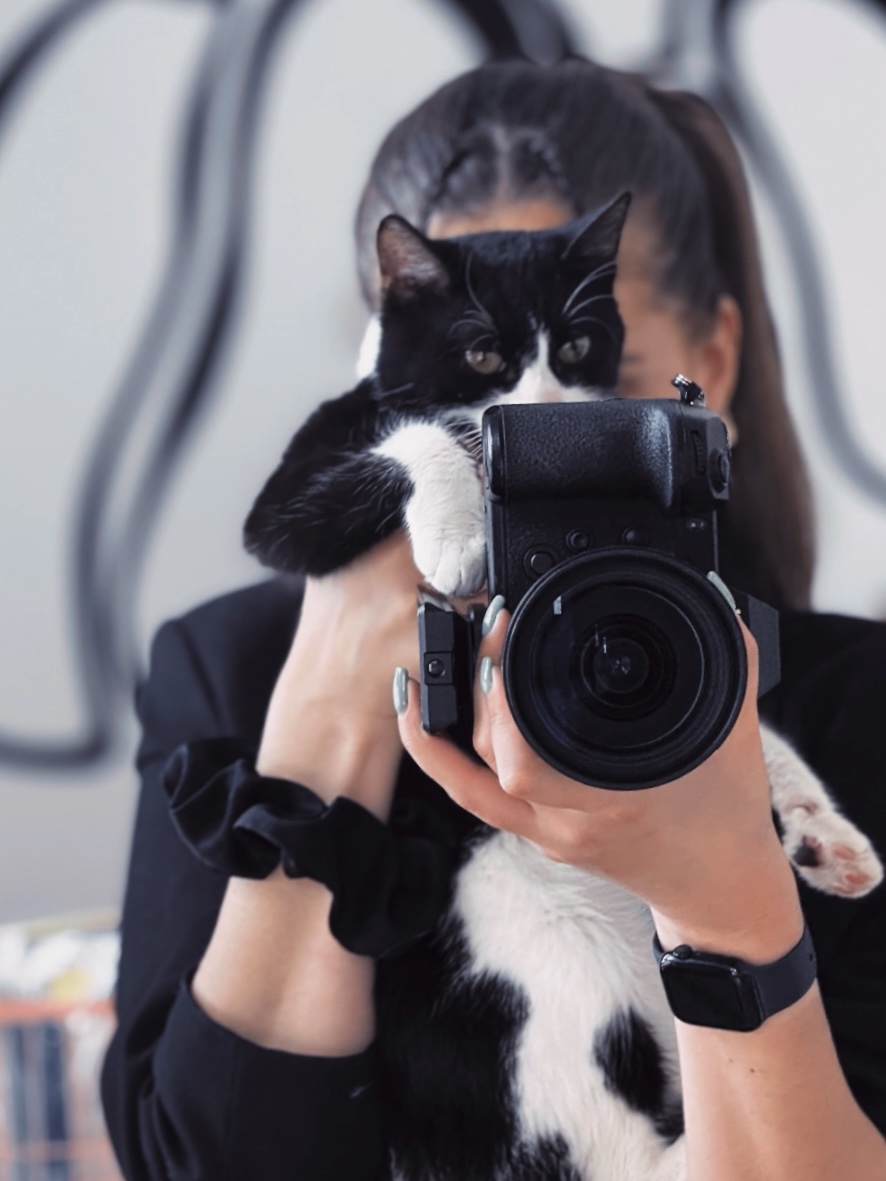 photograph of the videographer with a sweetie cat in her arms.